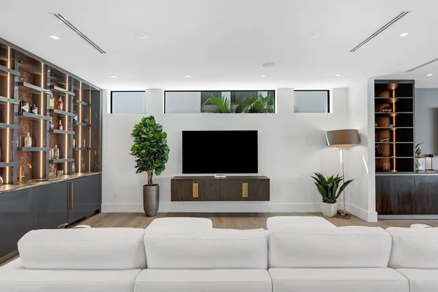 a kitchen with stainless steel appliances kitchen island granite countertop a stove and a sink