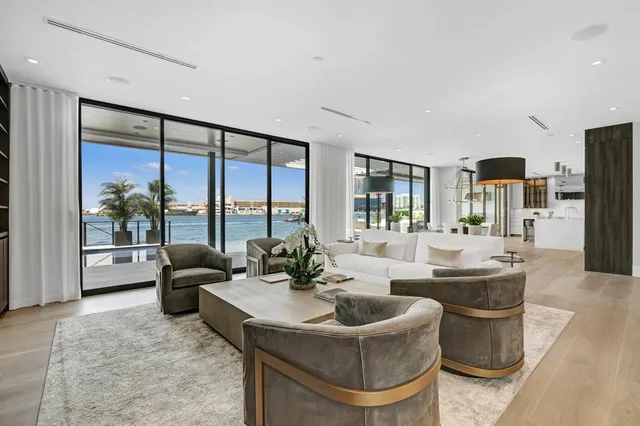 a kitchen with white cabinets and sink