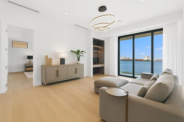 a bedroom with a large bed and a large window