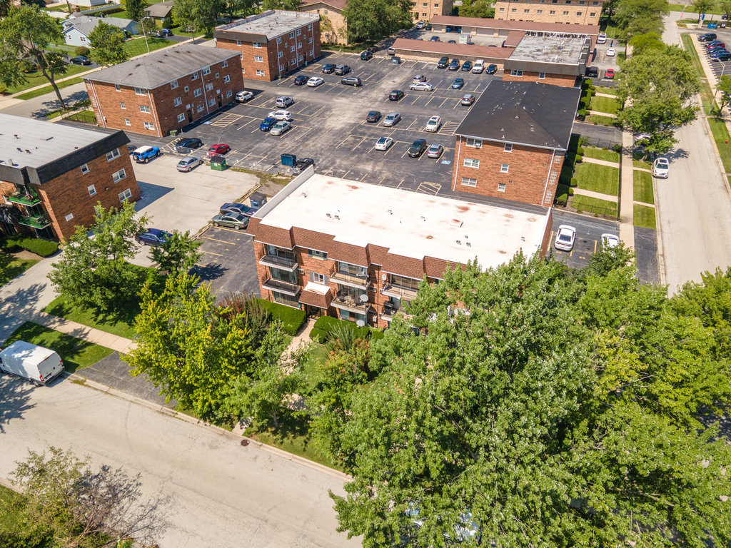 3756 West 120th Street, Unit 3A Alsip, IL 60803 - Photo 19 of 27 an aerial view of a house with a yard and trees