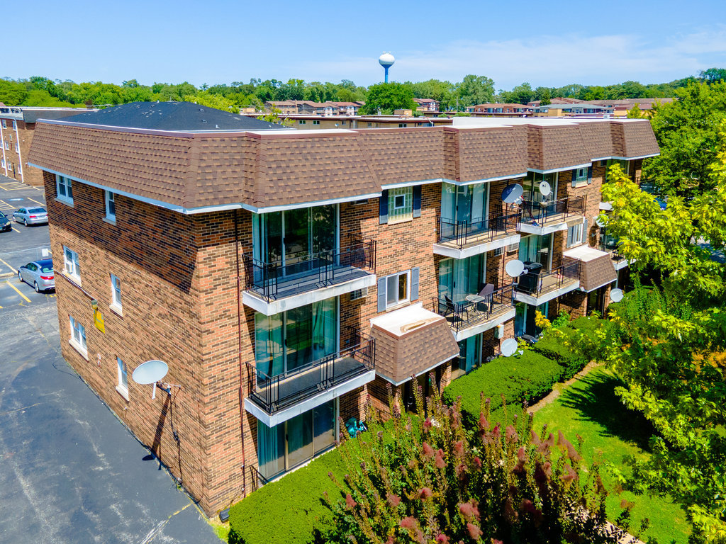 3756 West 120th Street, Unit 3A Alsip, IL 60803 - Photo 21 of 27 an aerial view of a house with a yard and a large tree