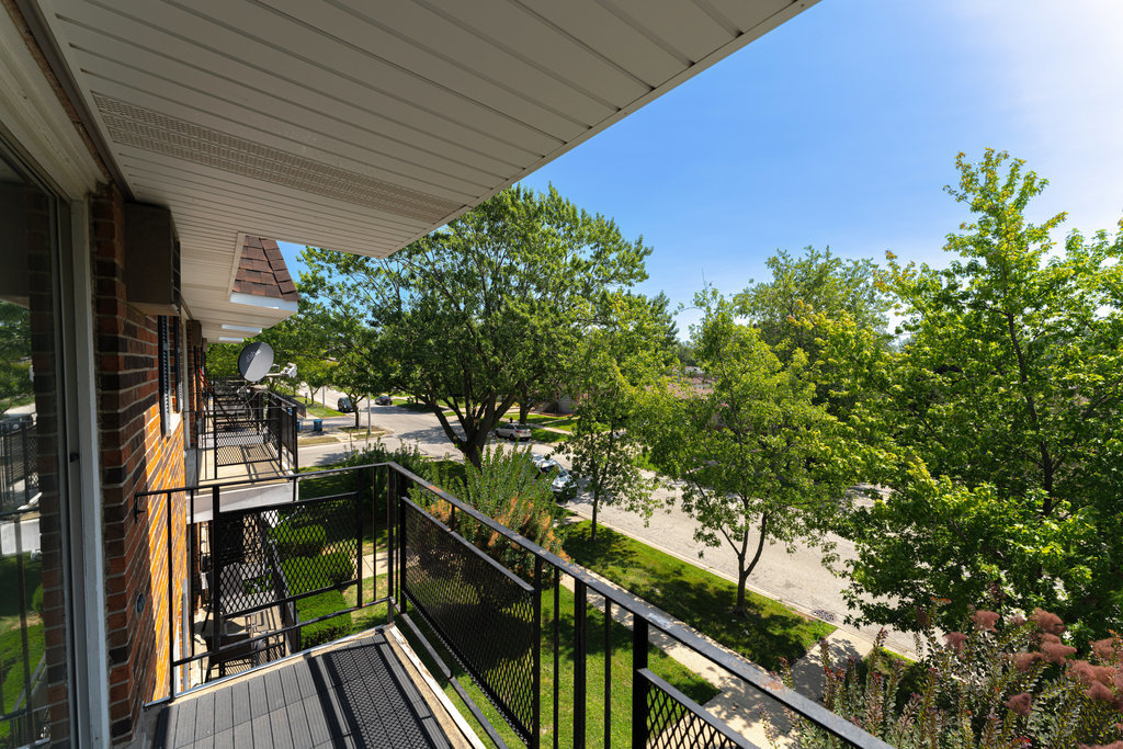3756 West 120th Street, Unit 3A Alsip, IL 60803 - Photo 27 of 27 a view of balcony with wooden floor and fence