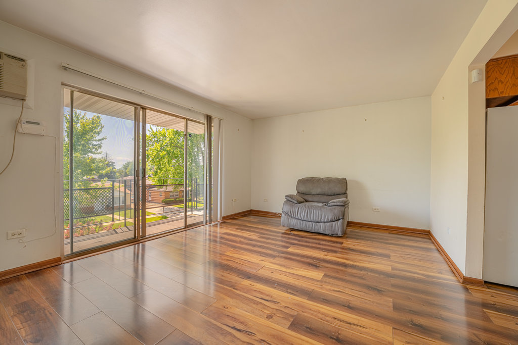 3756 West 120th Street, Unit 3A Alsip, IL 60803 - Photo 8 of 27 a view of empty room with wooden floor and fan