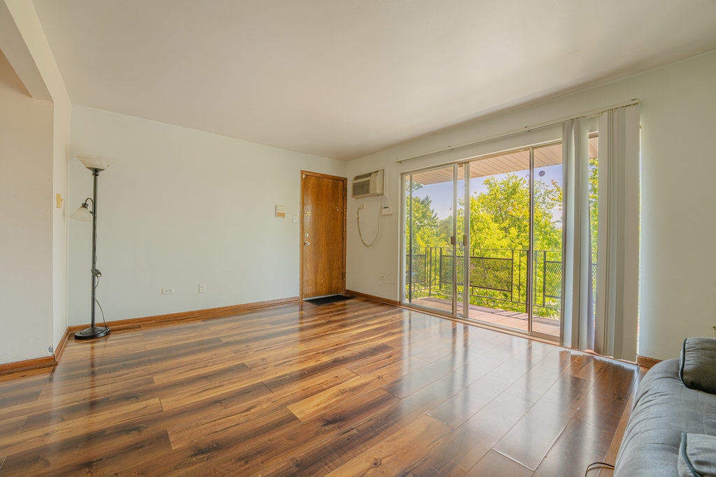 3756 West 120th Street, Unit 3A Alsip, IL 60803 - Photo 9 of 27 a view of an empty room with glass door and windows