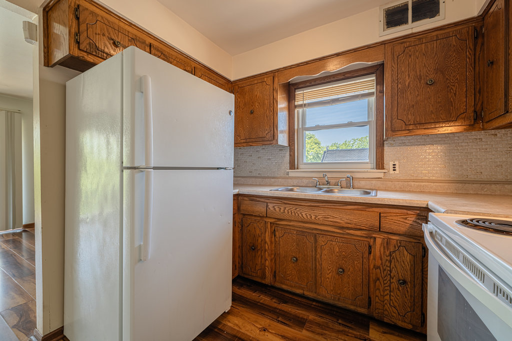 3756 West 120th Street, Unit 3A Alsip, IL 60803 - Photo 10 of 27 a kitchen with a refrigerator sink and stove