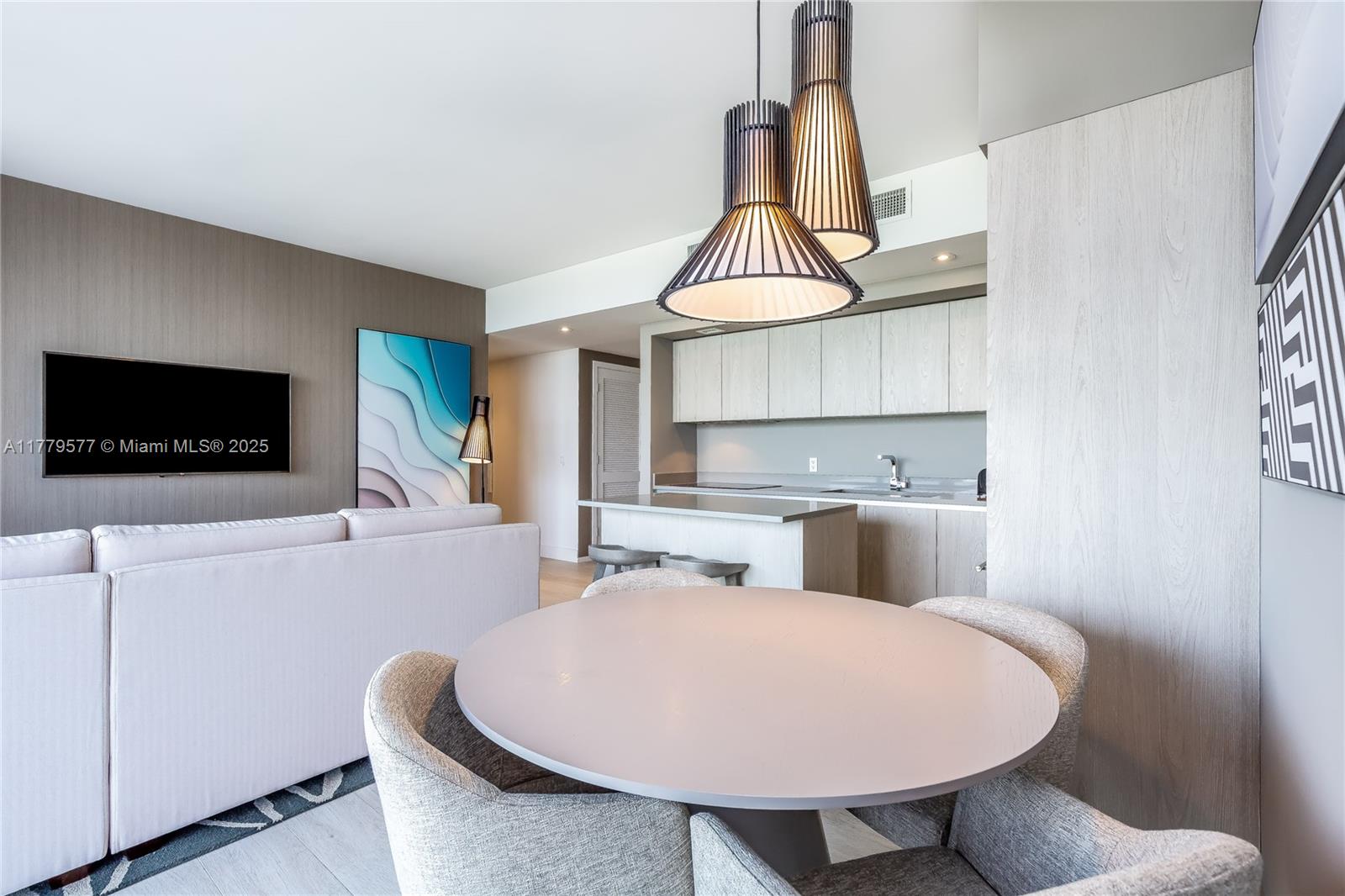 4010 South Ocean Drive, Unit R2204 Hollywood, FL 33019 - Photo 11 of 22 a living room with furniture a flat screen tv and a window