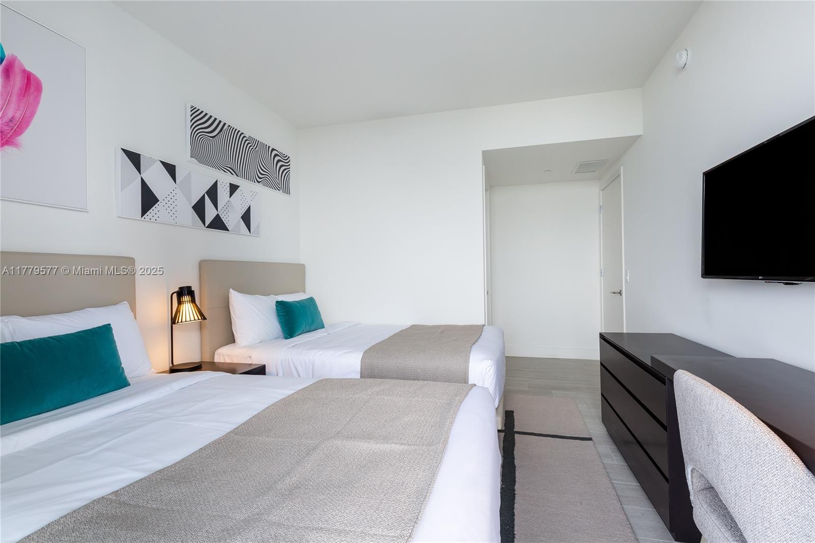 4010 South Ocean Drive, Unit R2204 Hollywood, FL 33019 - Photo 21 of 22 a living room with furniture and a flat screen tv