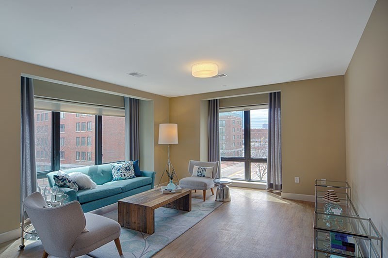 33 Rogers Street, Unit 419 Cambridge, MA 02142 - Photo 1 of 11 a living room with furniture and a large window