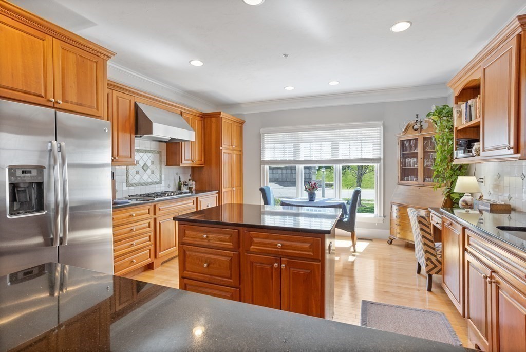 31 Sauta Farm Way, Unit 16 Hudson, MA 01749 - Photo 11 of 41 a kitchen with stainless steel appliances granite countertop a sink stove and refrigerator