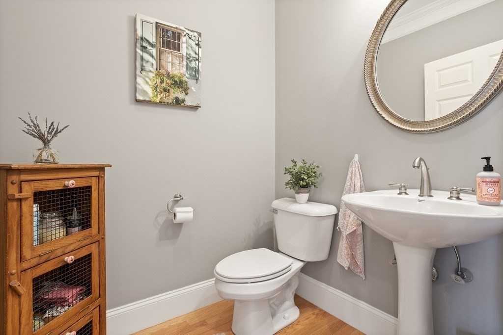 31 Sauta Farm Way, Unit 16 Hudson, MA 01749 - Photo 15 of 41 a bathroom with a toilet a sink and a mirror