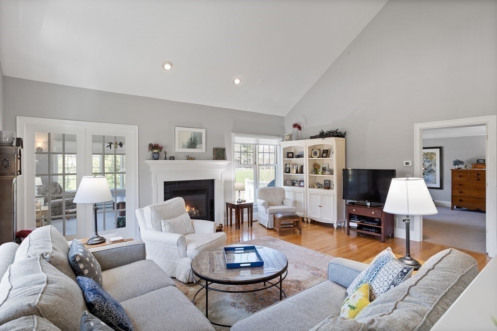 31 Sauta Farm Way, Unit 16 Hudson, MA 01749 - Photo 19 of 41 a living room with furniture and a fireplace