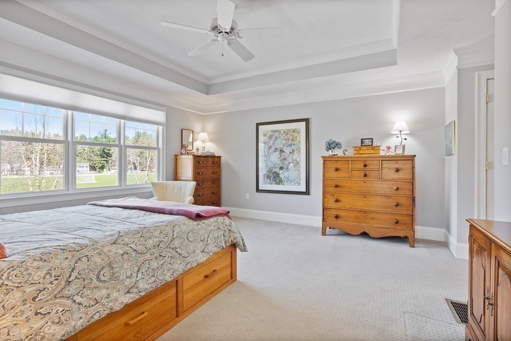 31 Sauta Farm Way, Unit 16 Hudson, MA 01749 - Photo 23 of 41 a bedroom with a bed and a dresser