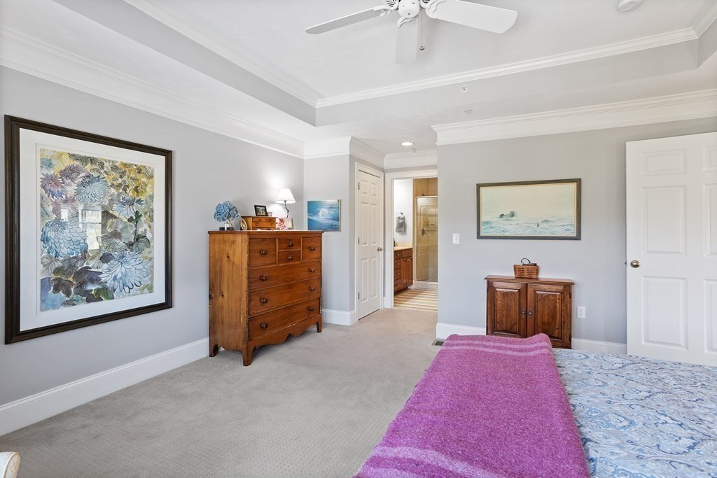 31 Sauta Farm Way, Unit 16 Hudson, MA 01749 - Photo 24 of 41 a bedroom with furniture and wooden floor