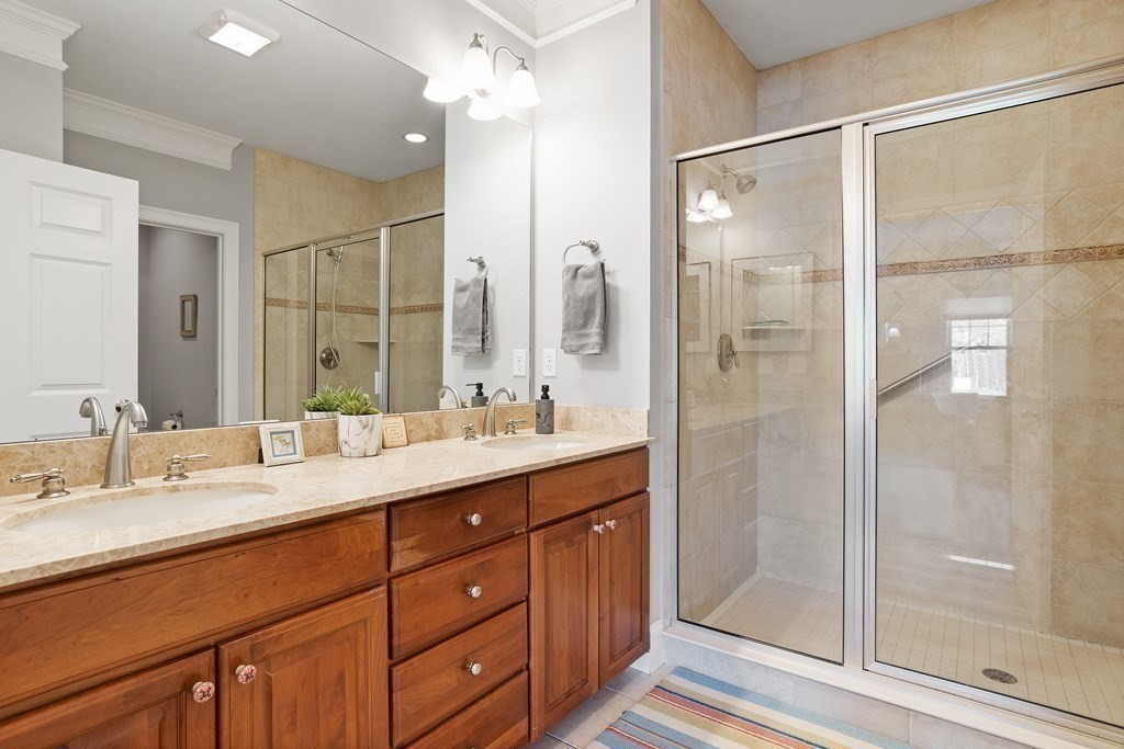 31 Sauta Farm Way, Unit 16 Hudson, MA 01749 - Photo 26 of 41 a bathroom with a double vanity sink mirror and shower