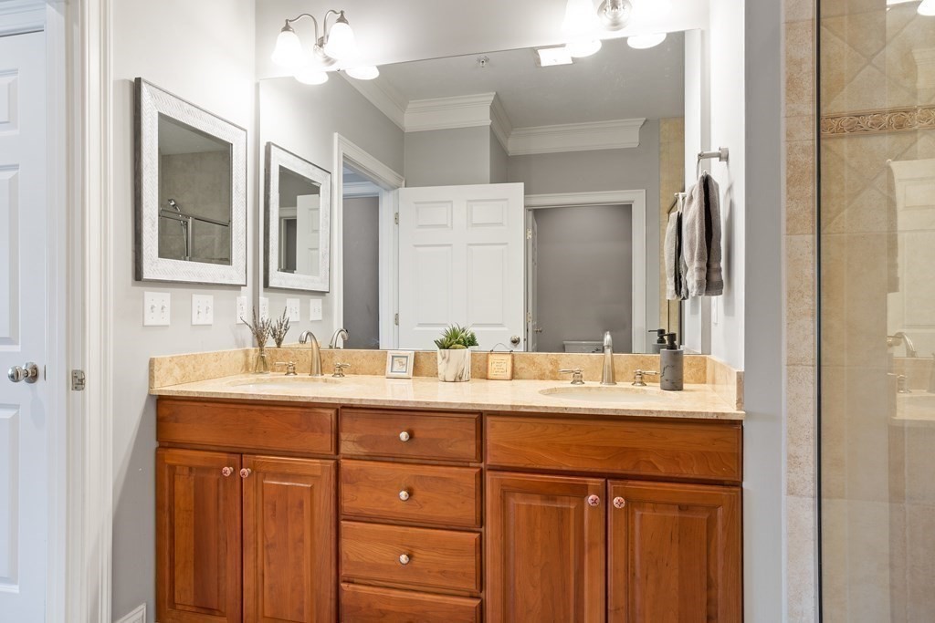 31 Sauta Farm Way, Unit 16 Hudson, MA 01749 - Photo 27 of 41 a bathroom with a sink double vanity and a mirror