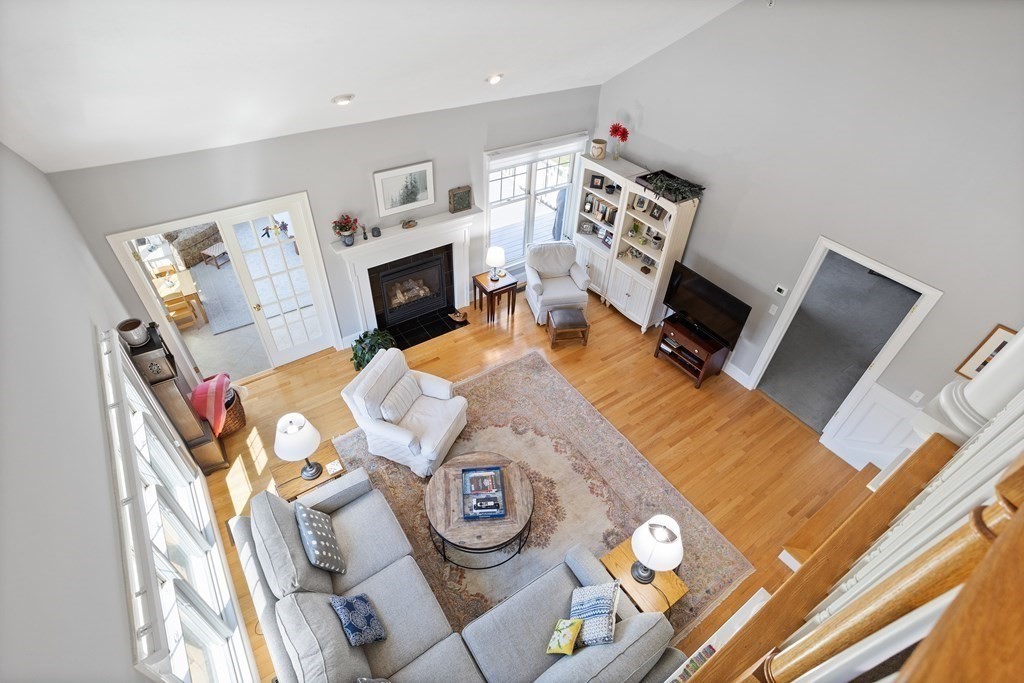 31 Sauta Farm Way, Unit 16 Hudson, MA 01749 - Photo 29 of 41 a living room with furniture and a fireplace
