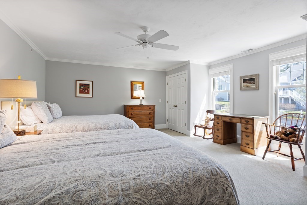 31 Sauta Farm Way, Unit 16 Hudson, MA 01749 - Photo 33 of 41 a bedroom with a bed and a couch