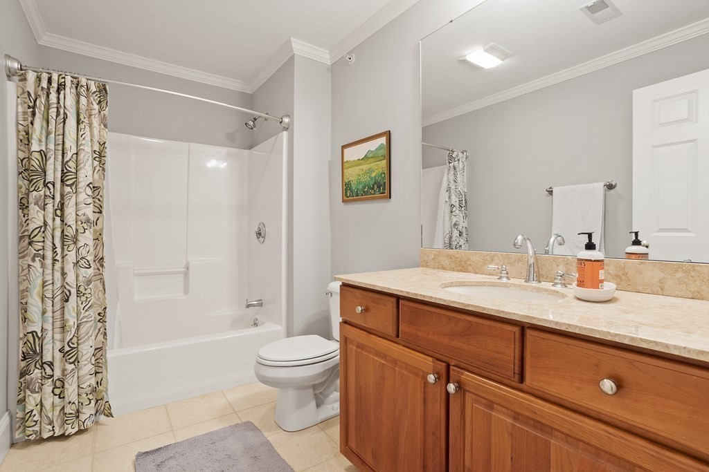 31 Sauta Farm Way, Unit 16 Hudson, MA 01749 - Photo 34 of 41 a bathroom with a granite countertop sink toilet and shower