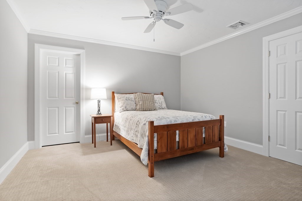 31 Sauta Farm Way, Unit 16 Hudson, MA 01749 - Photo 35 of 41 a bedroom with a bed lamp and closet