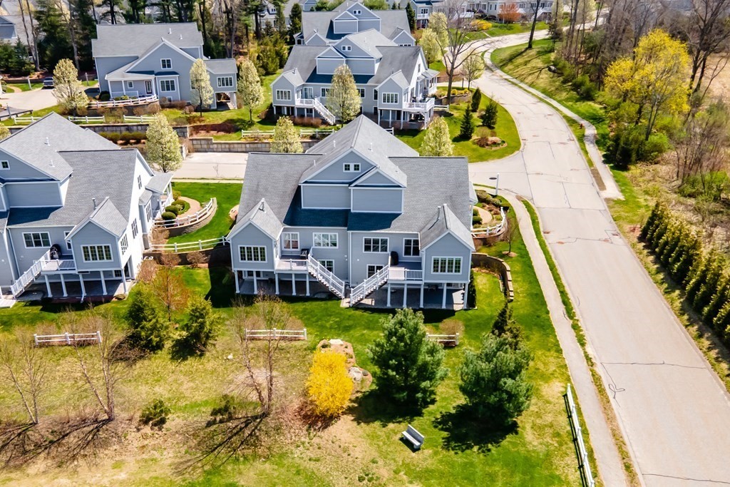 31 Sauta Farm Way, Unit 16 Hudson, MA 01749 - Photo 4 of 41 an aerial view of a swimming pool with outdoor seating