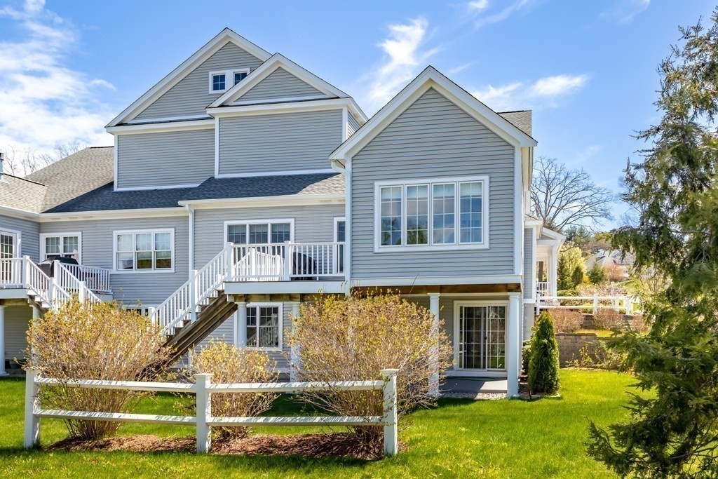 31 Sauta Farm Way, Unit 16 Hudson, MA 01749 - Photo 5 of 41 a front view of a house with a yard