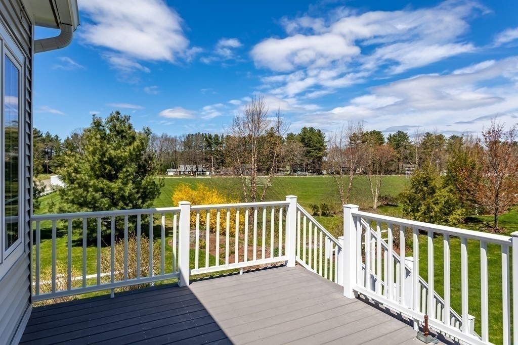 31 Sauta Farm Way, Unit 16 Hudson, MA 01749 - Photo 6 of 41 a view of a balcony with wooden floor & fence