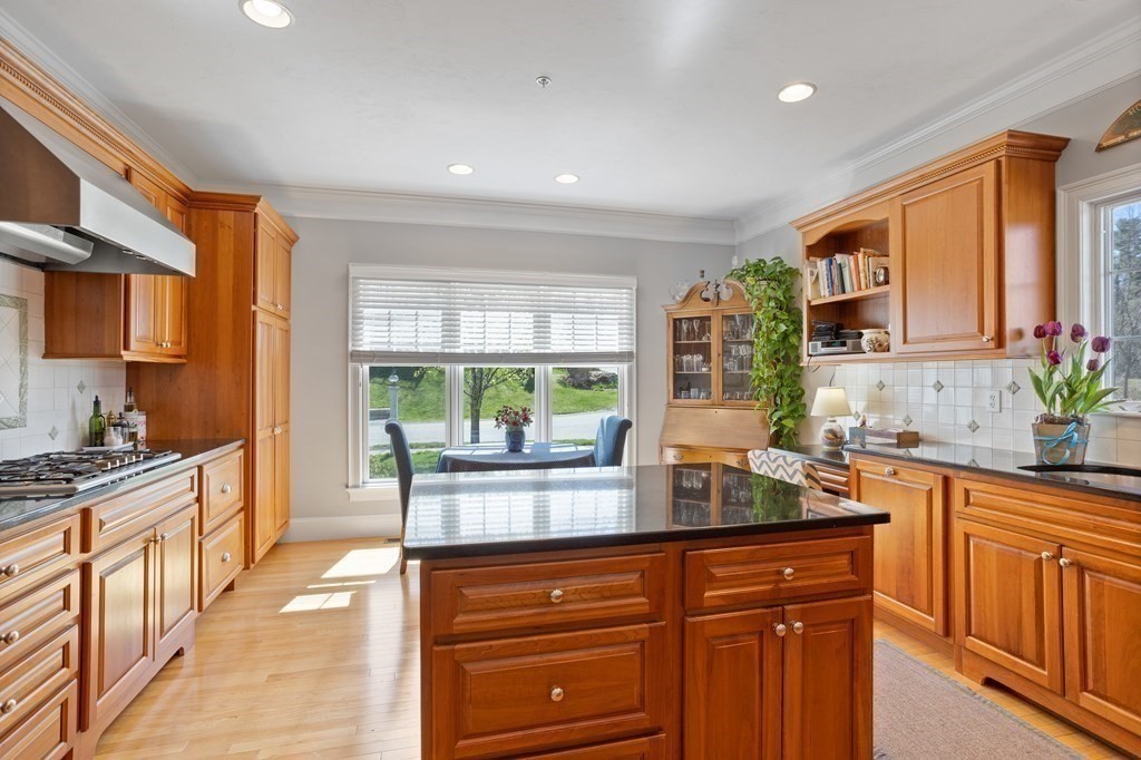 31 Sauta Farm Way, Unit 16 Hudson, MA 01749 - Photo 9 of 41 a kitchen with stainless steel appliances granite countertop a stove a sink dishwasher and cabinets with wooden floor