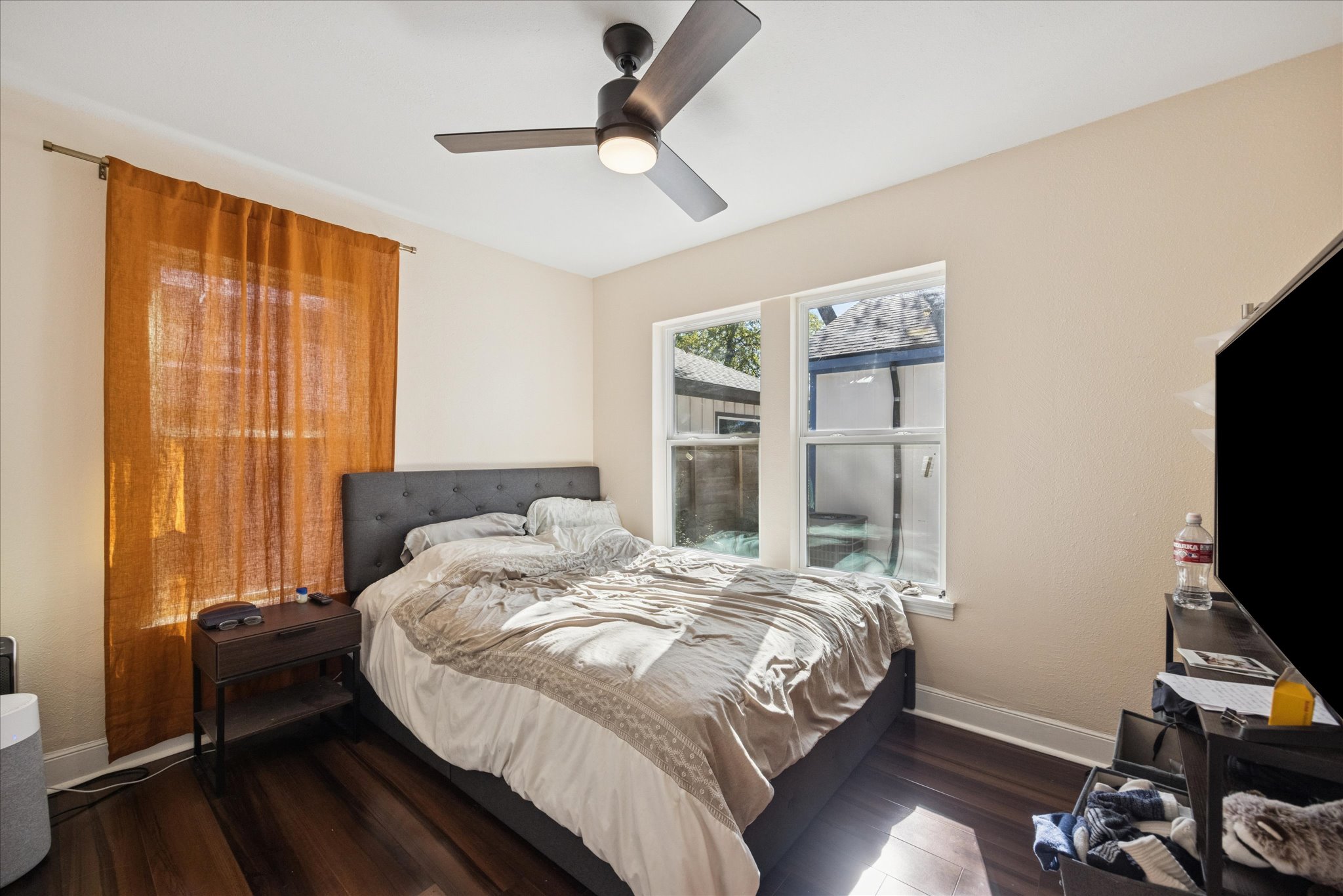 907 East 53rd Street Austin, TX 78751 - Photo 13 of 30 Bedroom featuring dark wood-style floors and a ceiling fan