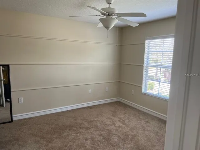 an empty room with a empty space and a window