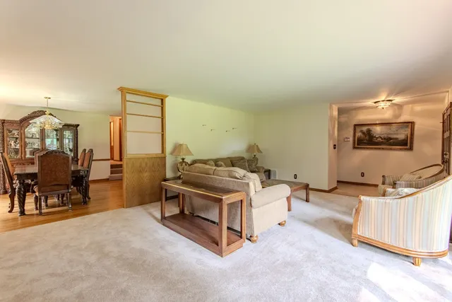 a bed room with a bed and a chair