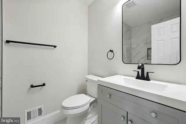 a view of storage and utility room with wooden floor