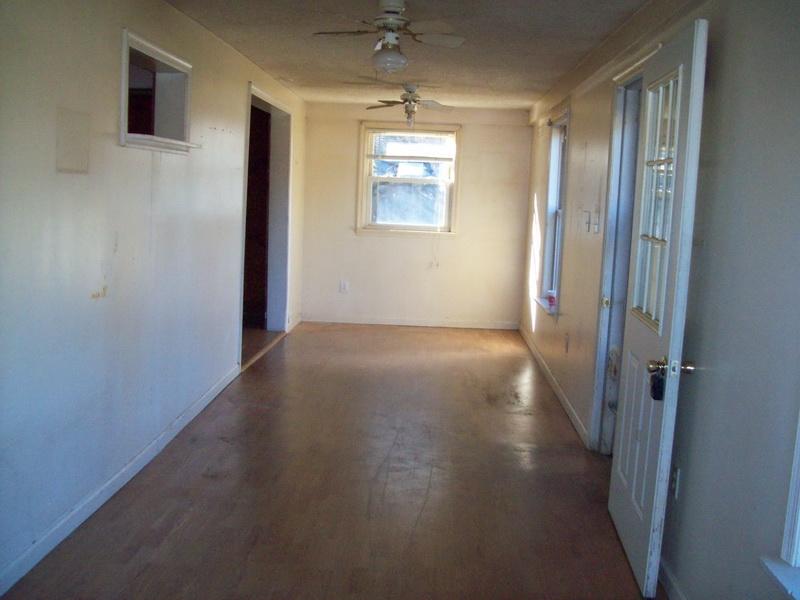 1142 Canning Factory Road Southwest Floyd, VA 24091 - Photo 2 of 17 an empty room with windows and closet
