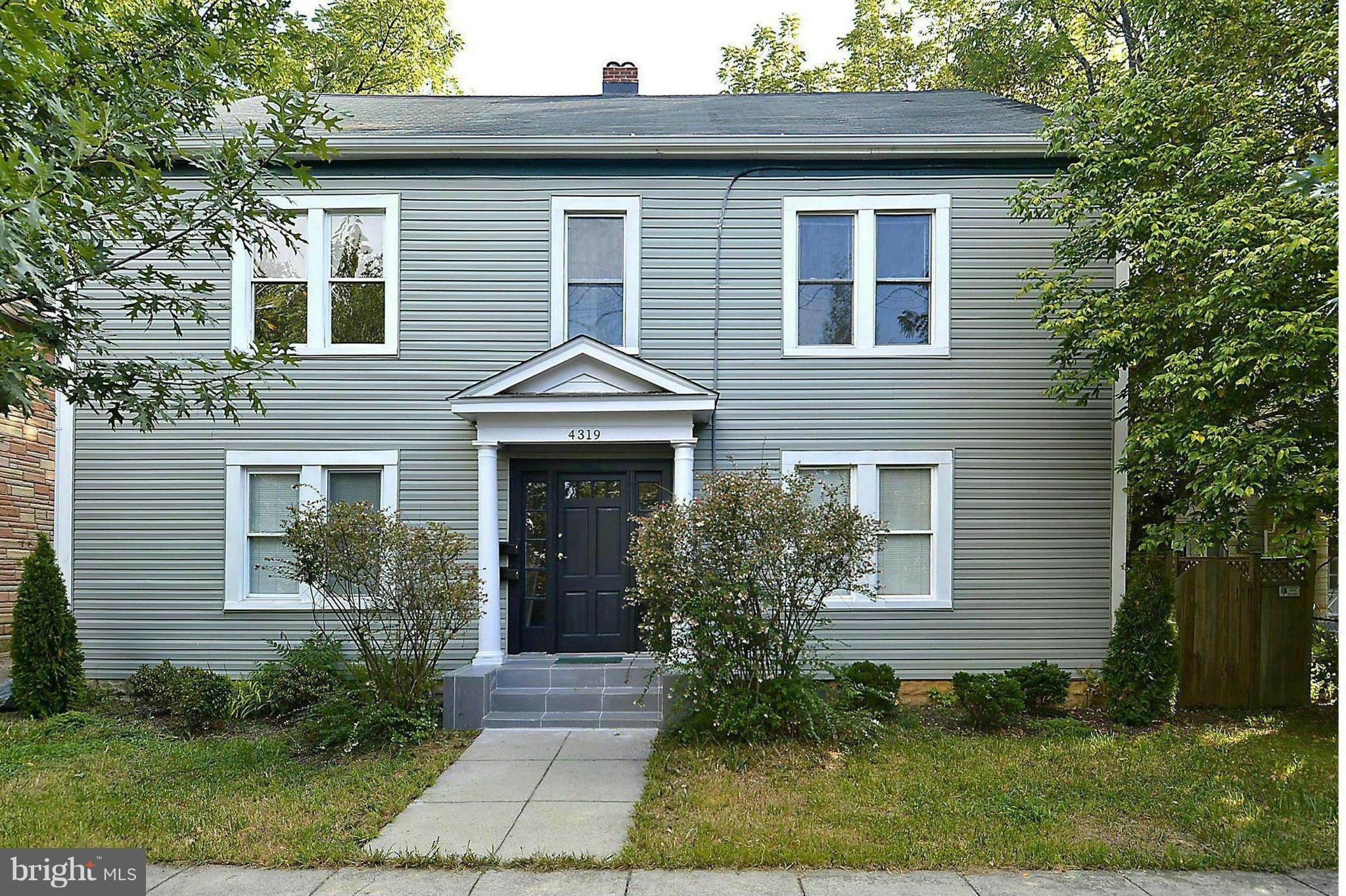 4319 River Road Northwest Washington, DC 20016 - Photo 2 of 22 a front view of a house with garden