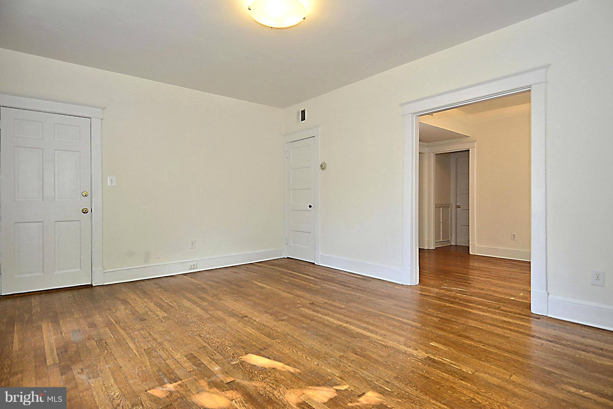 4319 River Road Northwest Washington, DC 20016 - Photo 15 of 22 a view of an empty room with wooden floor