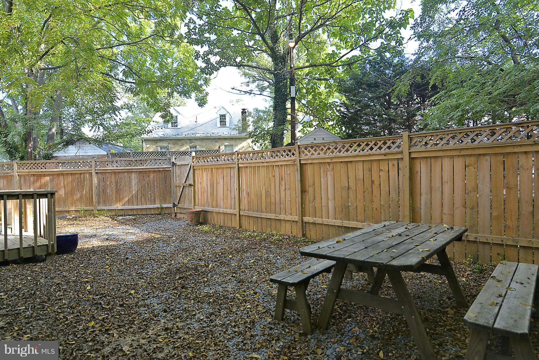 4319 River Road Northwest Washington, DC 20016 - Photo 18 of 22 a backyard of a house with table and chairs