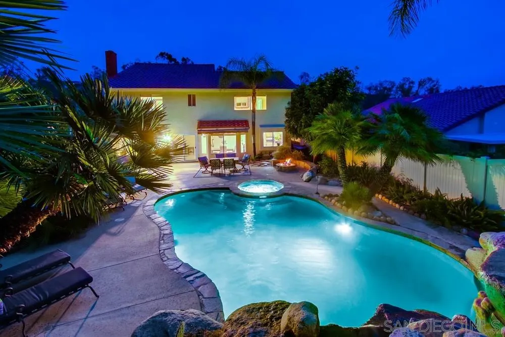 13952 Carriage Road Poway, CA 92064 - Photo 8 of 49 a view of a swimming pool with a yard