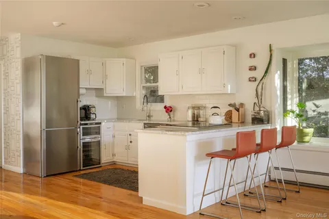 a kitchen with stainless steel appliances granite countertop a refrigerator sink and cabinets