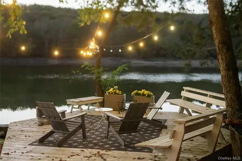 a table and chairs sitting in the water