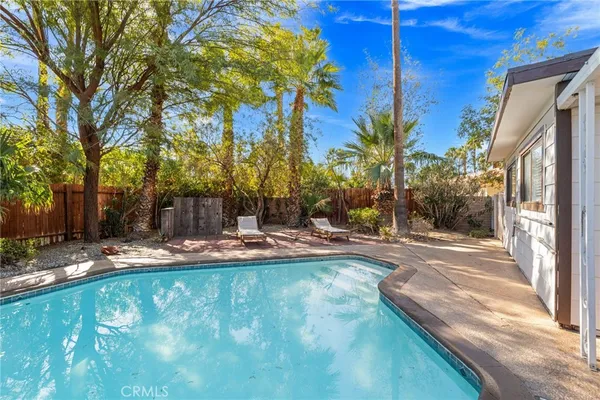 a view of a swimming pool with a patio
