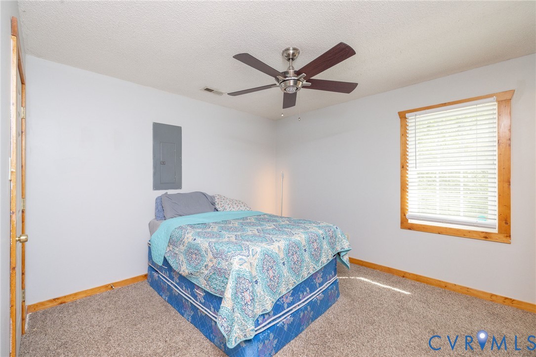 460 Horseshoe Road Jarratt, VA 23867 - Photo 13 of 24 a bedroom with a bed and a window