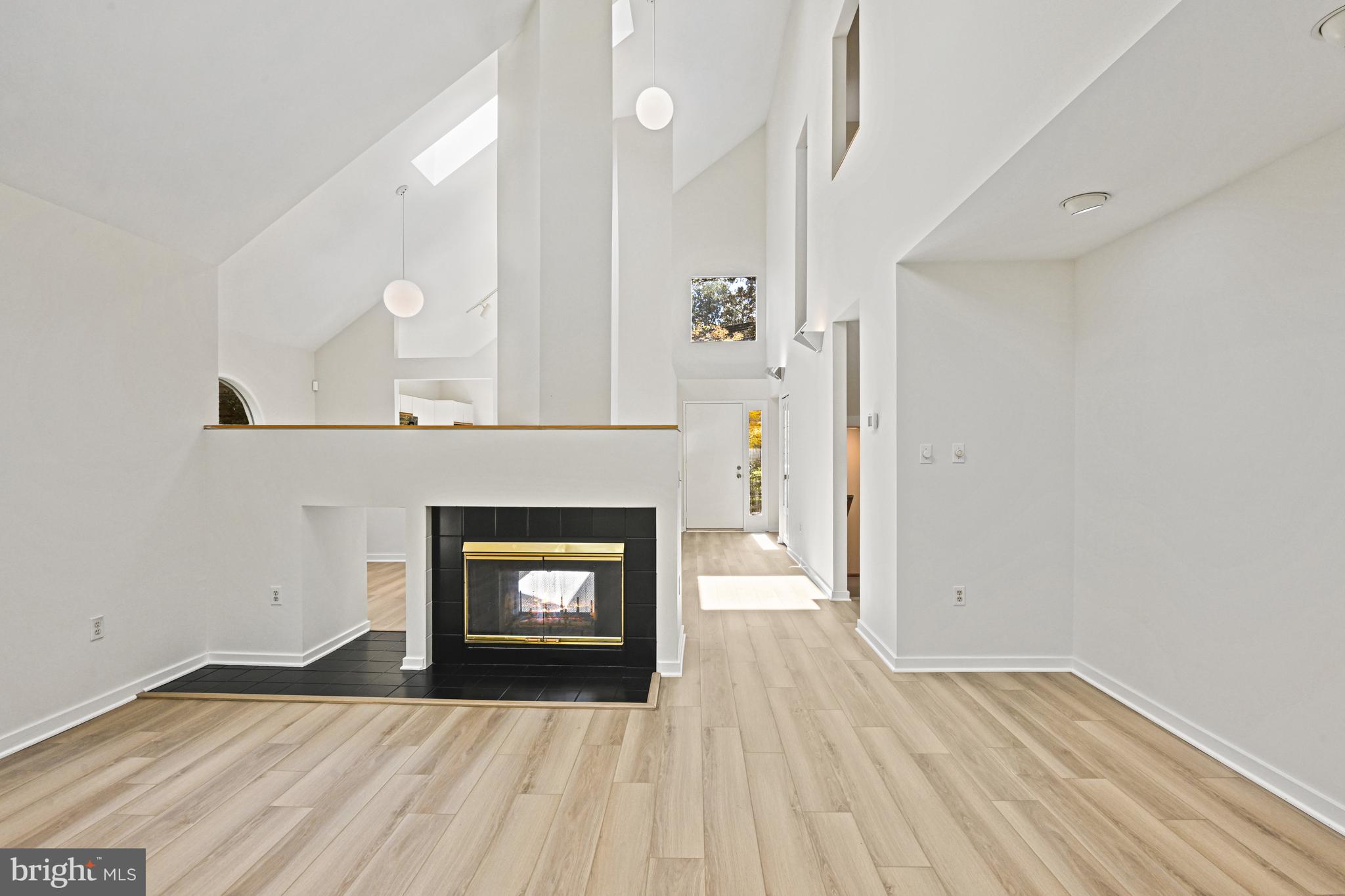 11504 Turnbridge Lane Reston, VA 20194 - Photo 15 of 51 a view of a livingroom with a fireplace and wooden floor
