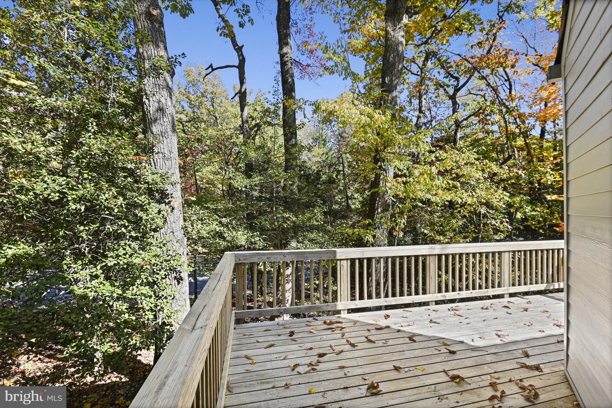 11504 Turnbridge Lane Reston, VA 20194 - Photo 18 of 51 a roof deck with wooden floor and fence