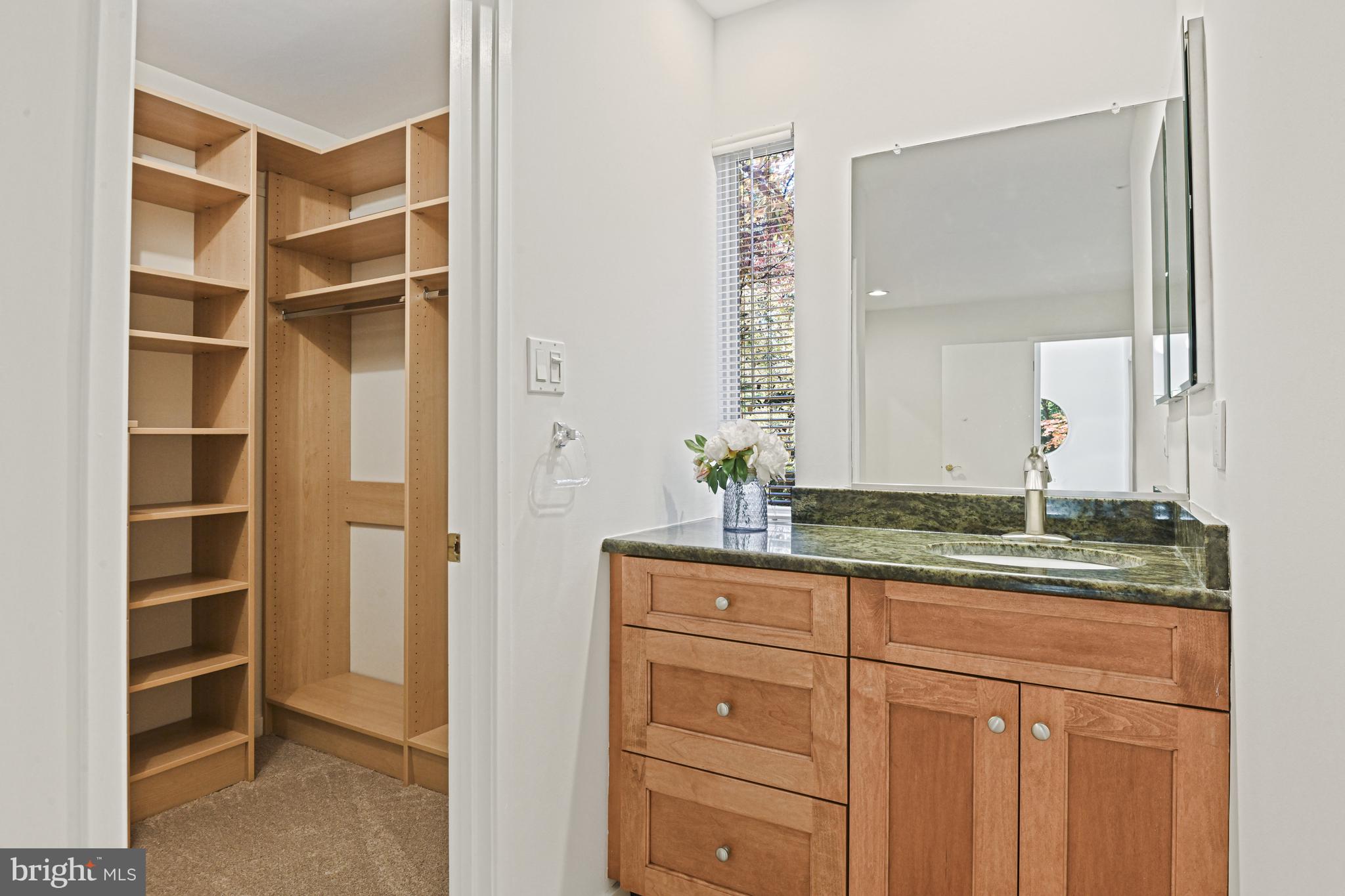 11504 Turnbridge Lane Reston, VA 20194 - Photo 28 of 51 a bathroom with a granite countertop sink and a mirror