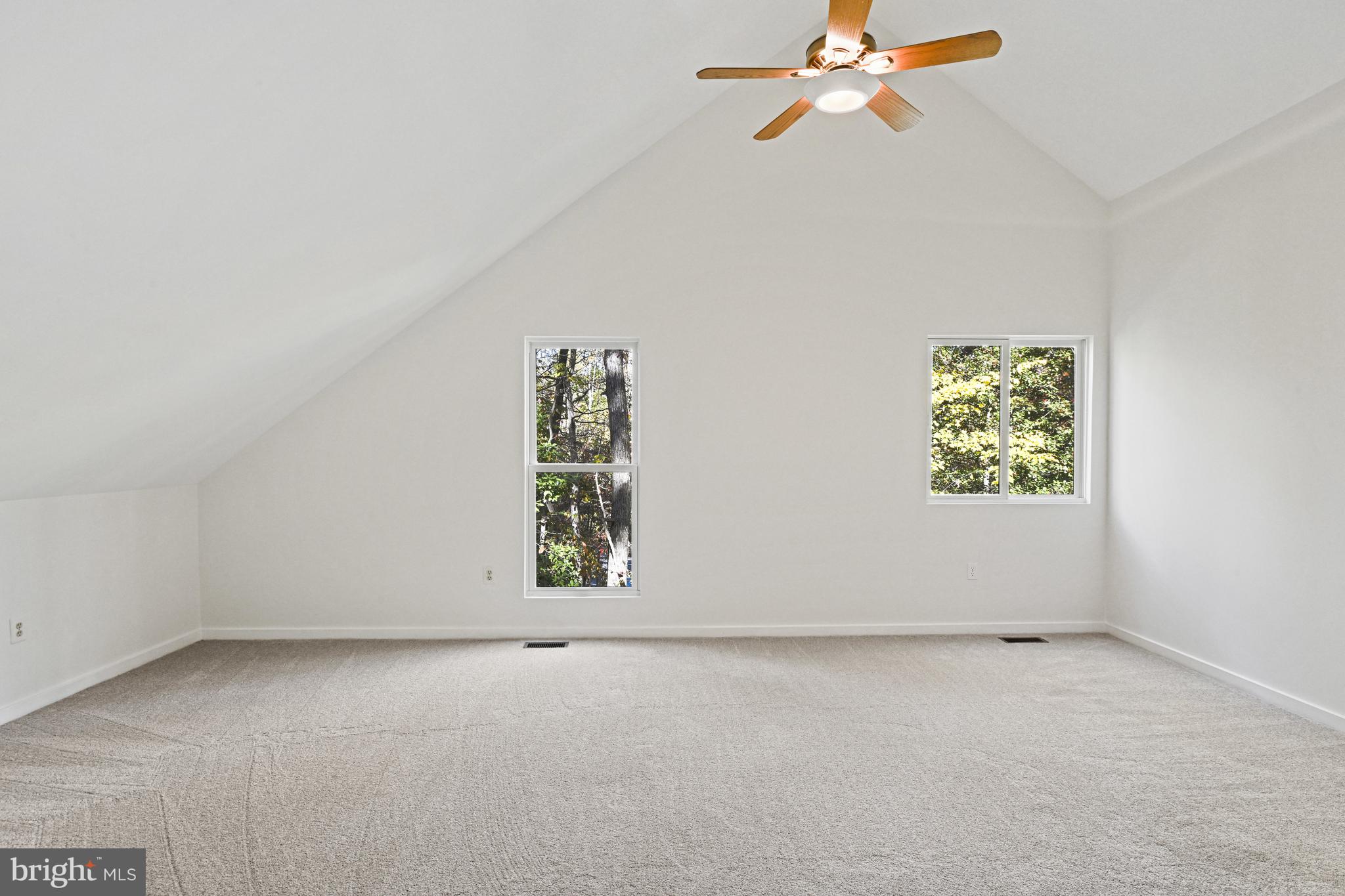 11504 Turnbridge Lane Reston, VA 20194 - Photo 32 of 51 an empty room with windows and fan