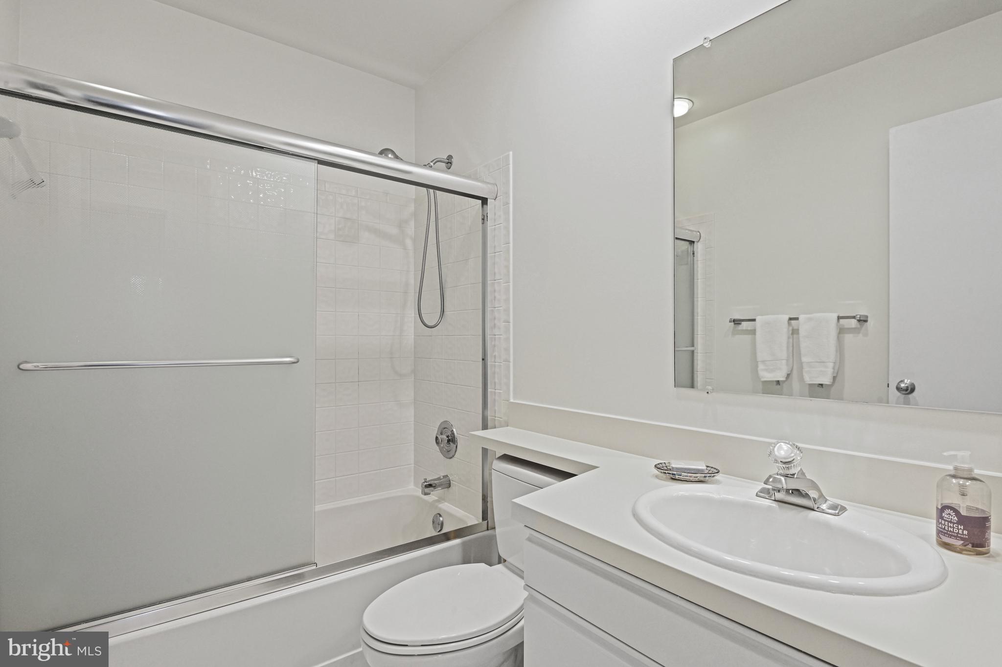 11504 Turnbridge Lane Reston, VA 20194 - Photo 36 of 51 a bathroom with a sink a toilet and shower