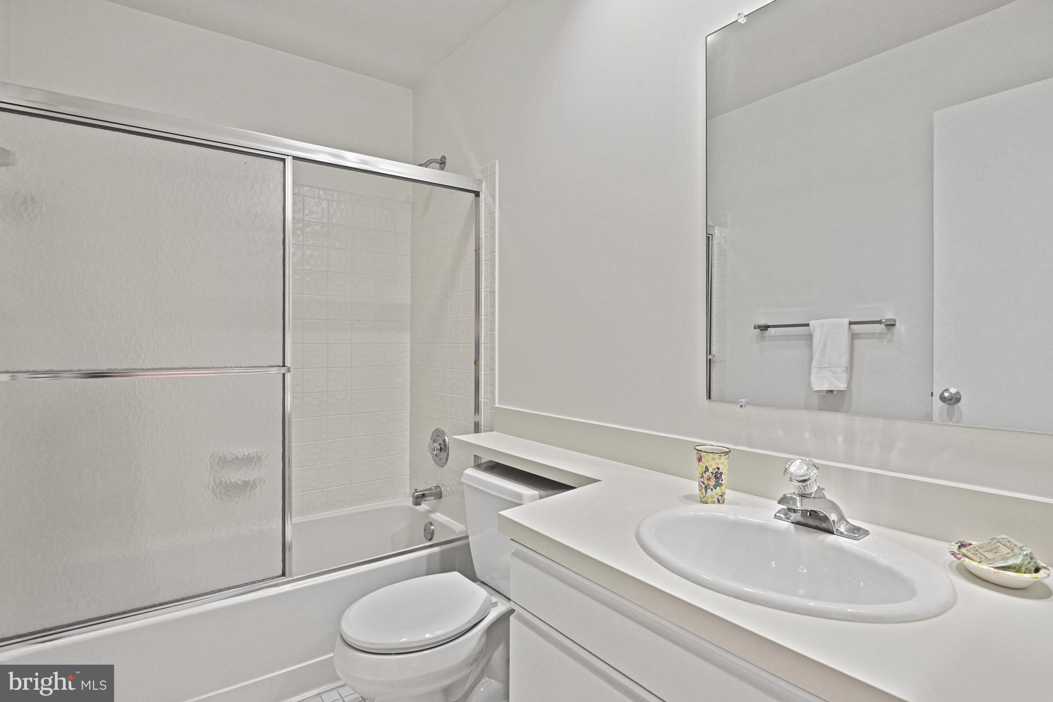 11504 Turnbridge Lane Reston, VA 20194 - Photo 44 of 51 a bathroom with a sink toilet and shower