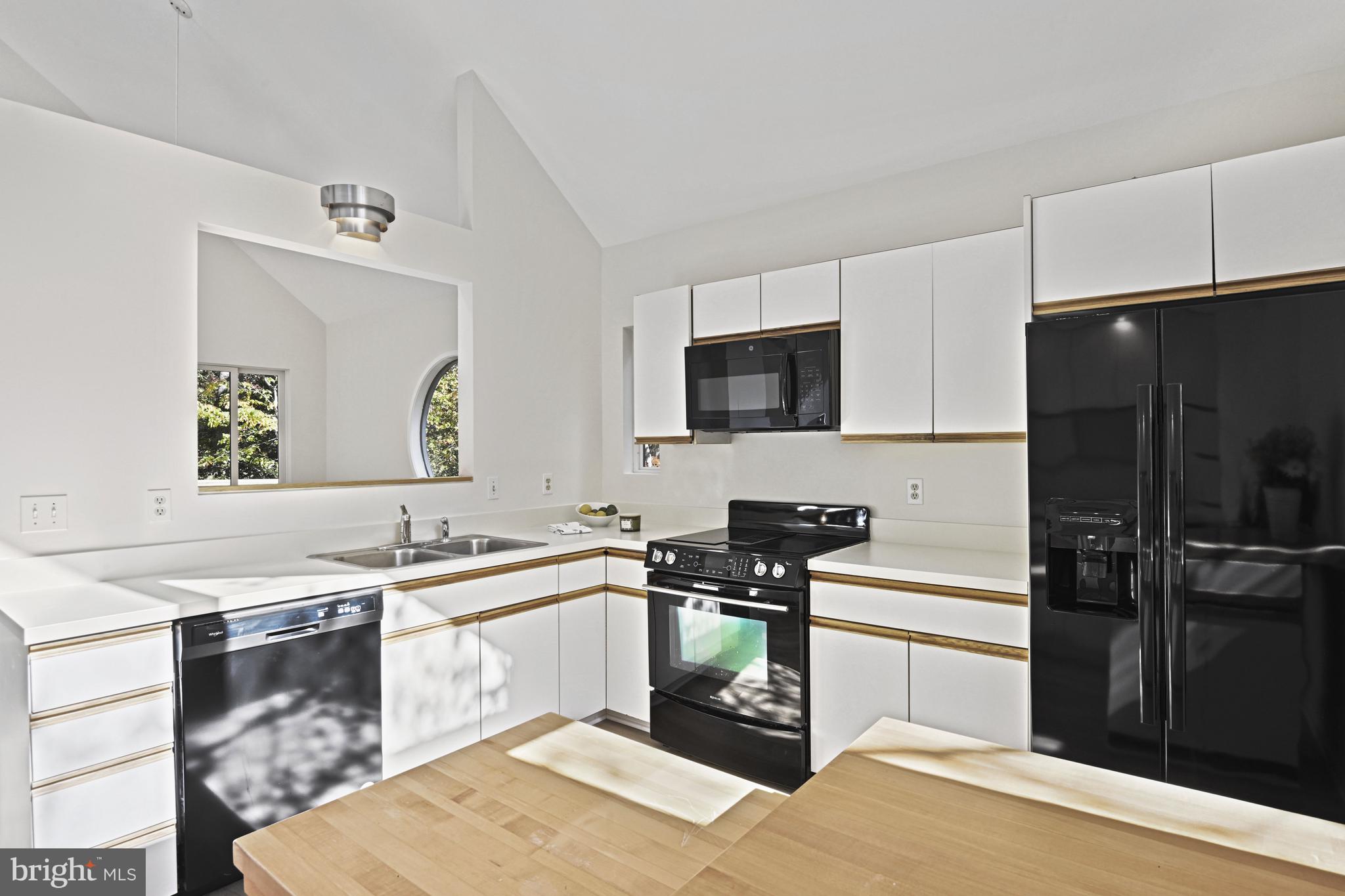 11504 Turnbridge Lane Reston, VA 20194 - Photo 8 of 51 a kitchen with a sink appliances and cabinets