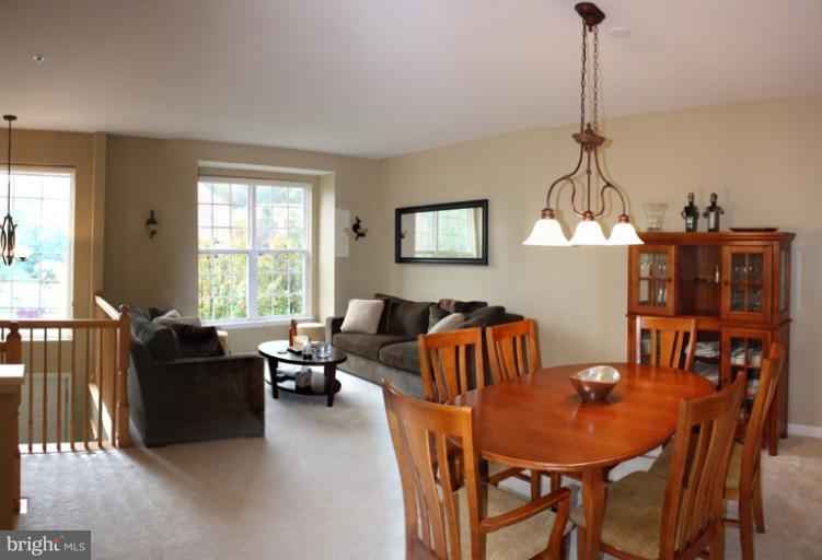 3742 Hope Commons Circle Frederick, MD 21704 - Photo 13 of 17 a living room with furniture a window and a dining table