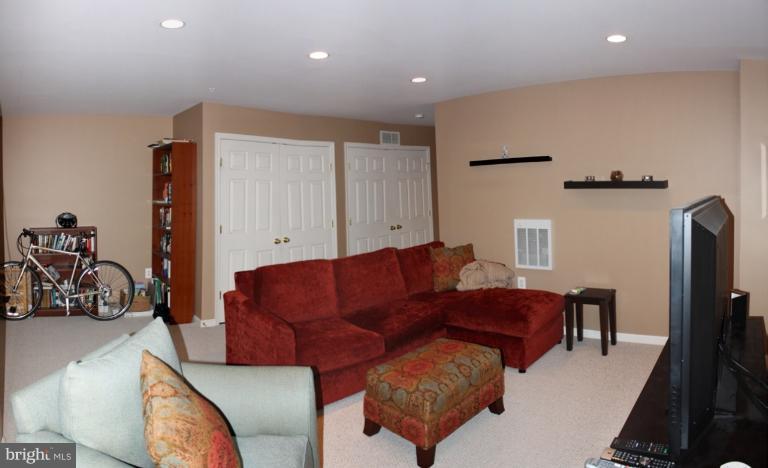 3742 Hope Commons Circle Frederick, MD 21704 - Photo 5 of 17 a living room with furniture and a flat screen tv