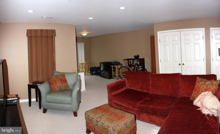 3742 Hope Commons Circle Frederick, MD 21704 - Photo 6 of 17 a living room with furniture and a couch